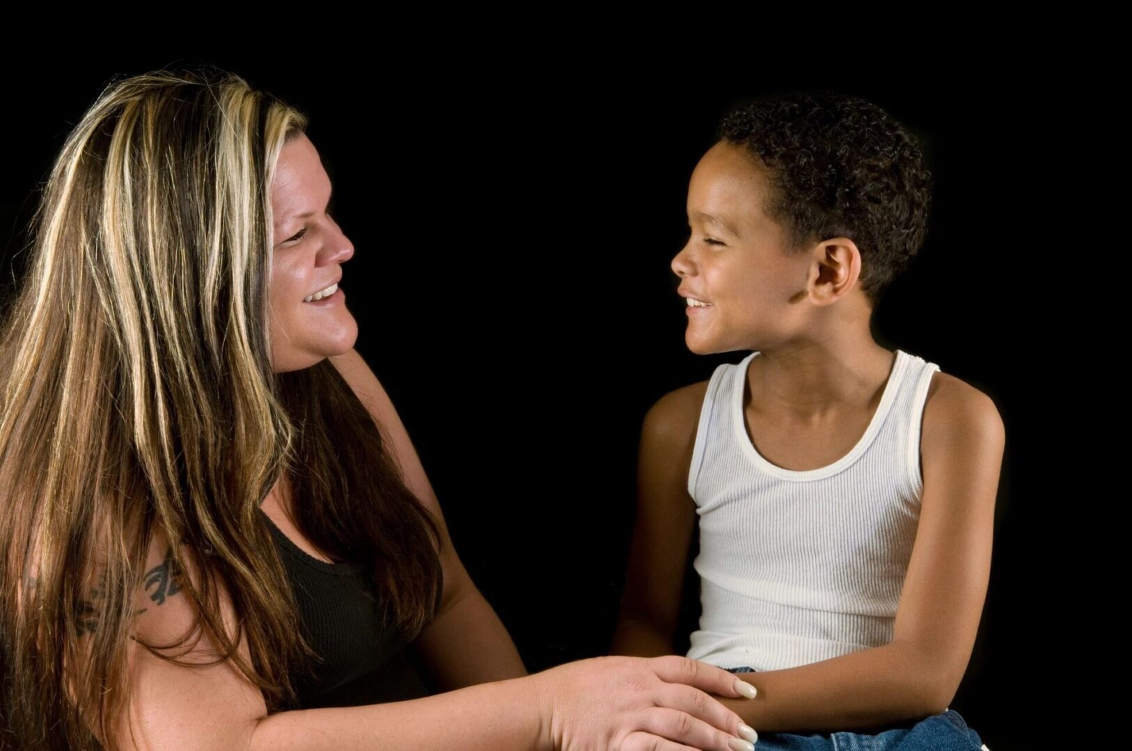 A woman and child are smiling for the camera.