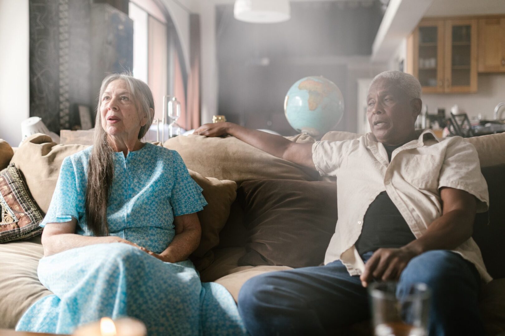 A group of people sitting on top of a couch.